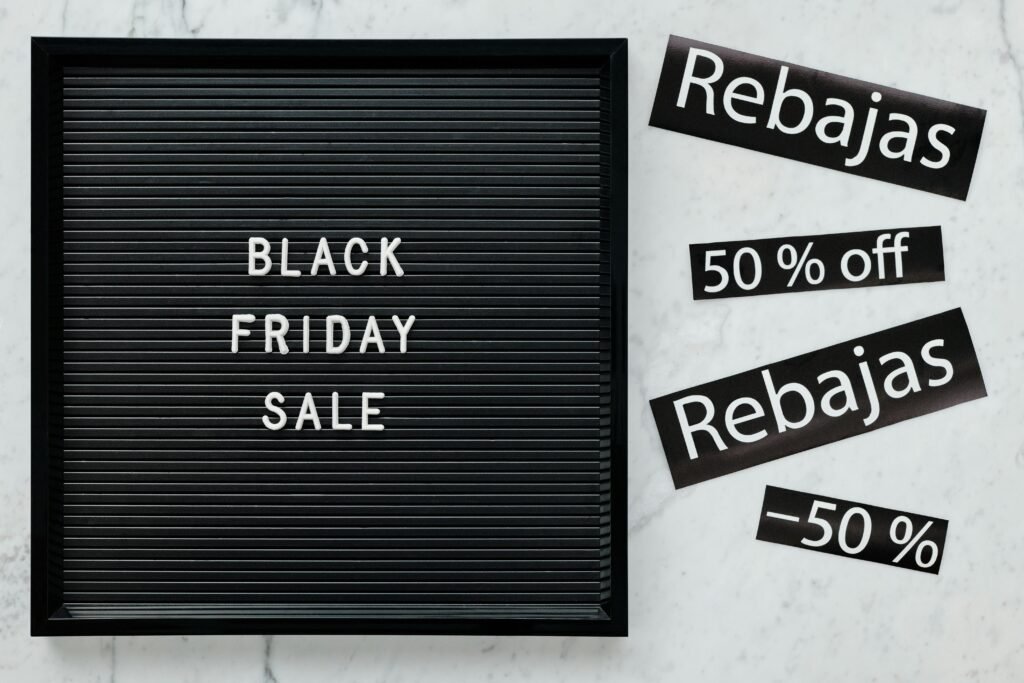 Black Friday sale board featuring discounts in English and Spanish for seasonal promotions.